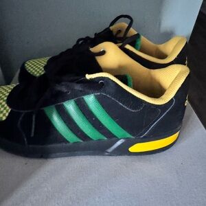 Adidas Black and Green Shoes with Yellow Highlights